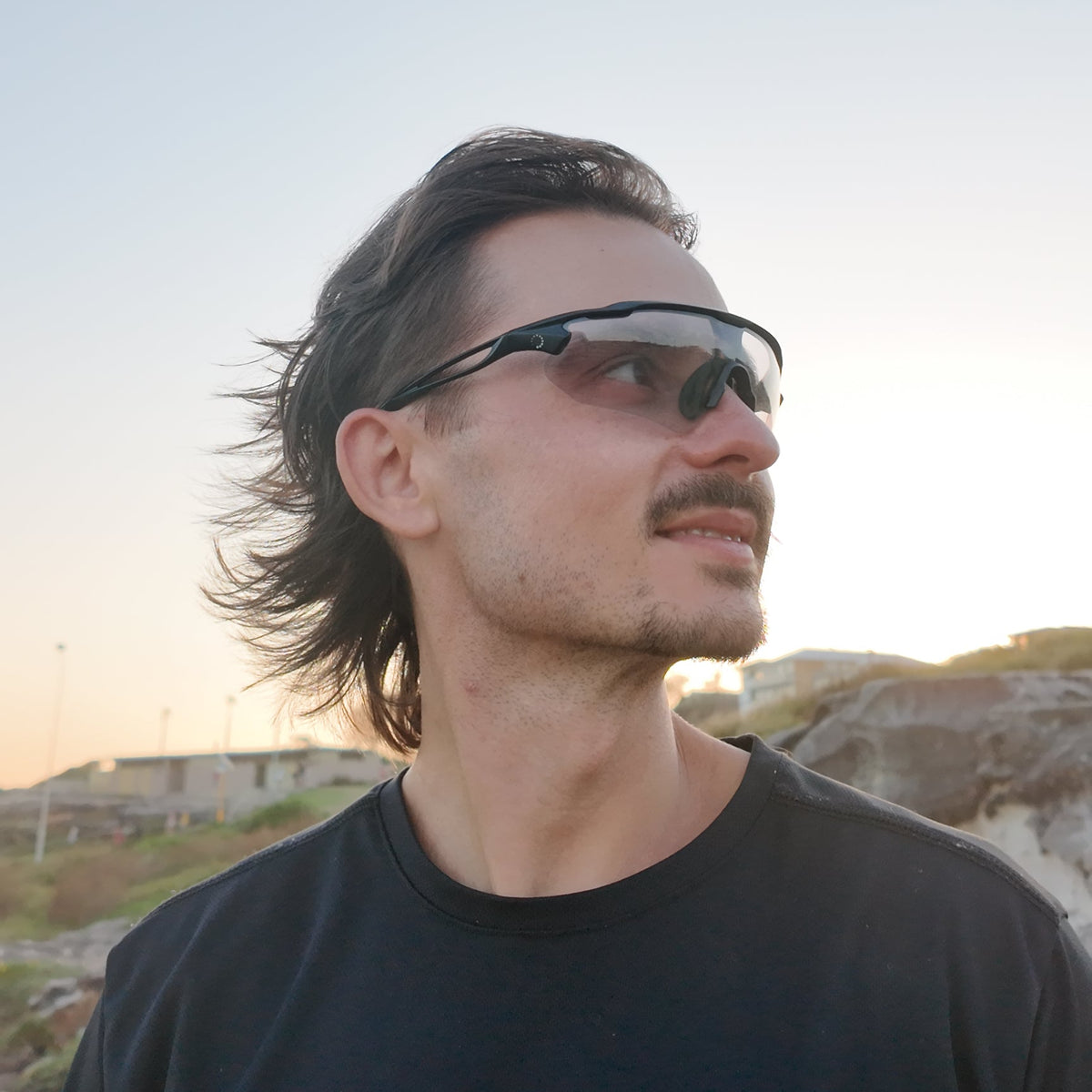 Tim, founder of Reyourrun, wearing Reyourrun sport sunglasses at the coast